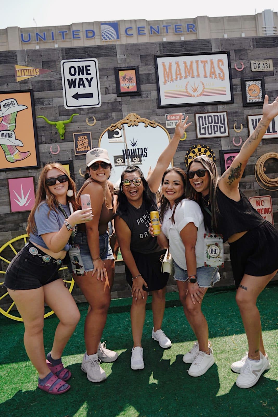 group of girls holding seltzers